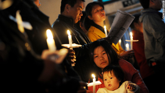 Chinese Catholics pray as they attend an Easter service at the historic South Cathedral in Beijing on April 7.